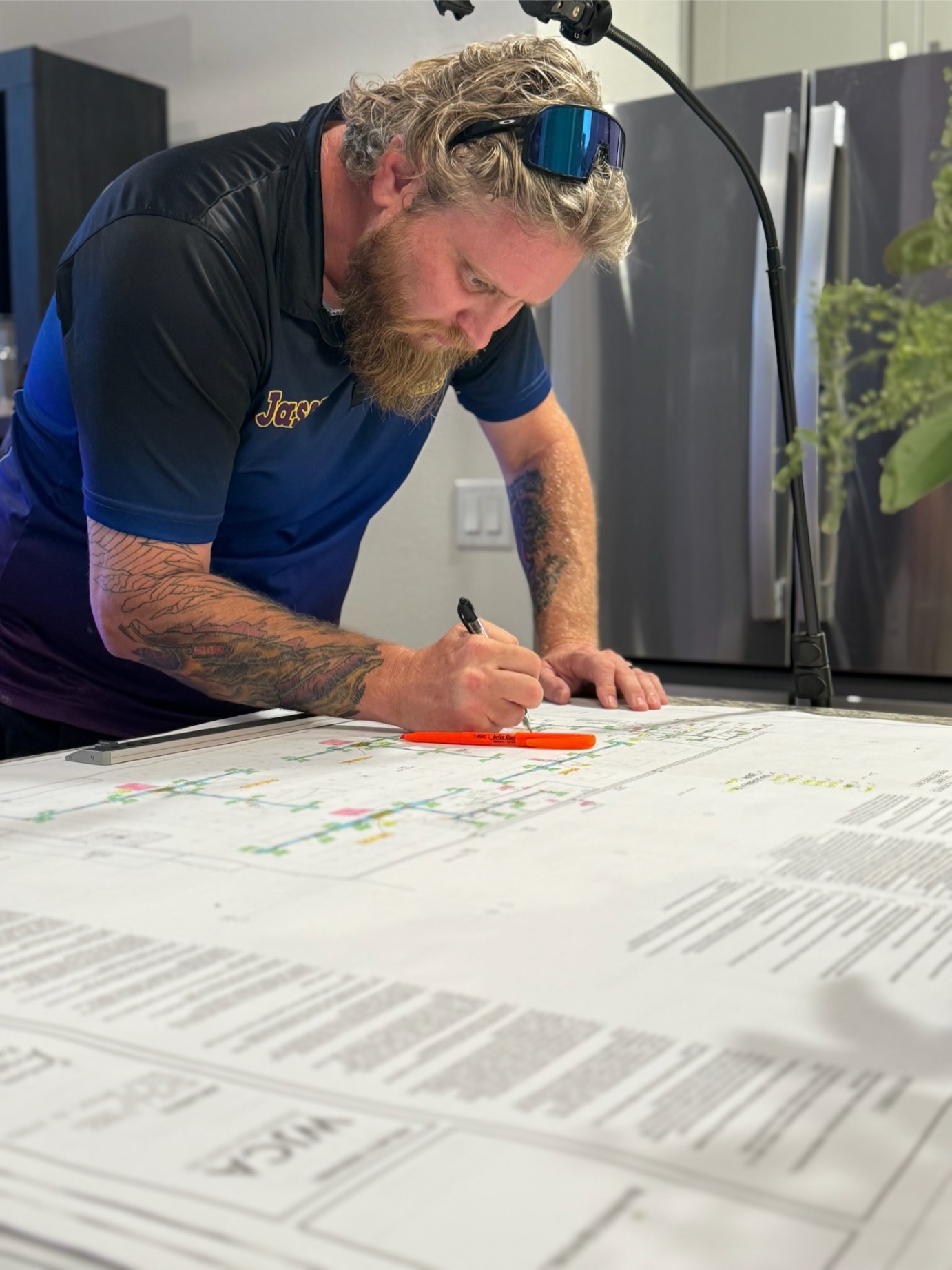 Jason from Rock Hard Refrigeration reviewing wiring diagrams
