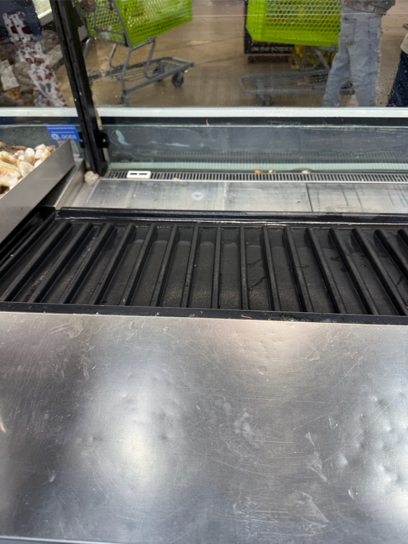 Meat display case cleared and defrosted after Rock Hard service