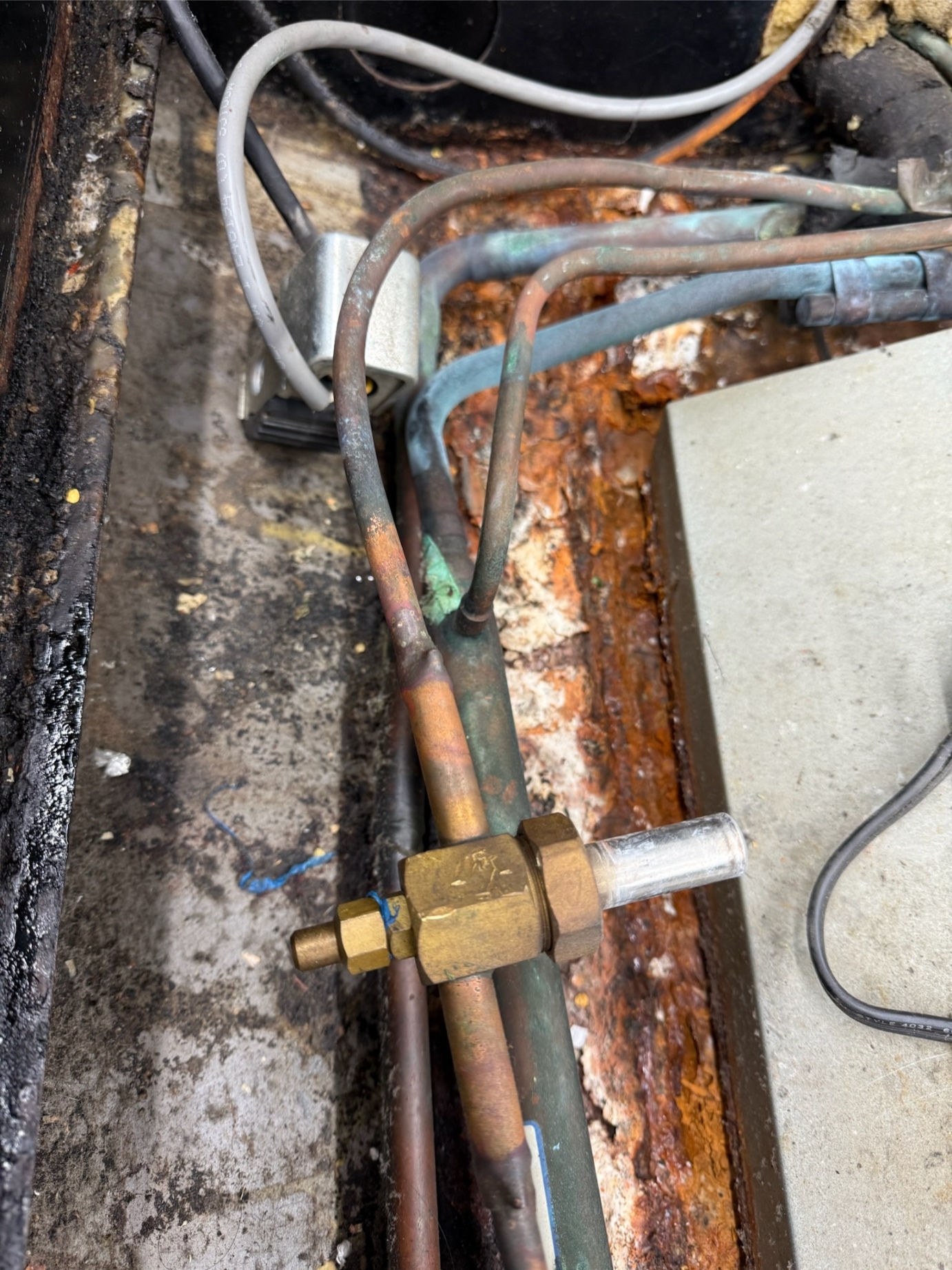 Brass service valve and suction line during Rock Hard commercial refrigeration repair — cold storage service